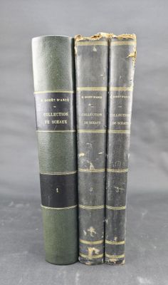 three books are stacked on top of each other on a table
