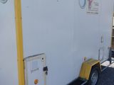 an image of a trailer that is parked in a lot
