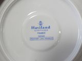 a white plate with a blue and white logo on it