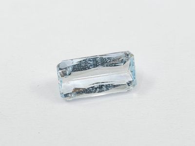 an image of a blue topazte stone on a white surface