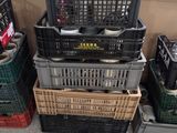 many crates stacked on top of each other on the floor