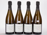 trois bouteilles de vin sont alignées sur une surface blanche