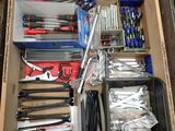 a box full of tools that are sitting on the floor