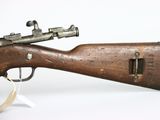 a close up of a rifle on a white background with a tag