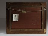 a picture of an old wooden box with a tag on it