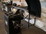 a machine that is sitting in a room with a lot of tools