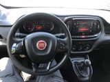 the interior of a car with a steering wheel and dashboard controls