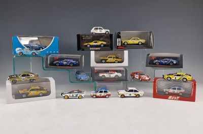 a lot of toy cars that are in a display case