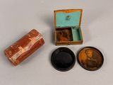 a small wooden box with a lid and a small wooden box with a lid