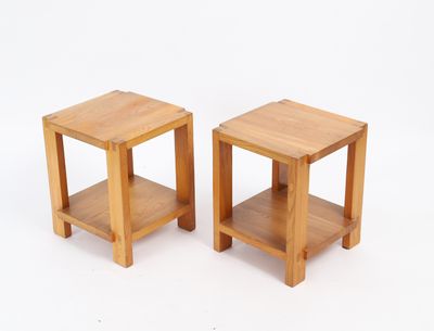 pair of small wooden side tables on a white background