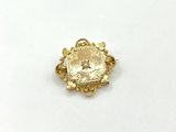 a close up of a gold ring on a white surface