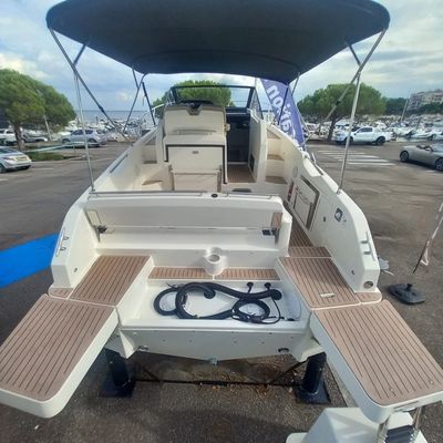 a boat that is sitting in the parking lot