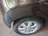 a close up of a car ' s tire on the ground