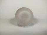 a glass object that is sitting on a white surface