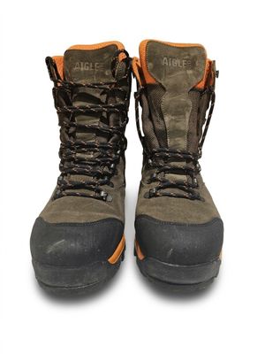 a pair of boots that are on a white surface
