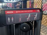a sign on the side of a gym equipment rack
