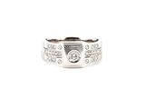 a close up of a ring with a diamond on it