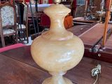 a lamp that is sitting on a table in a room