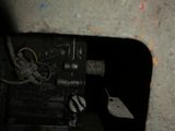 an image of a hole in a wall with a piece of electrical equipment