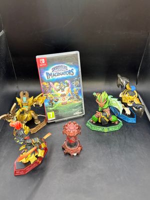 plein de figurines et un jeu vidéo sur la table