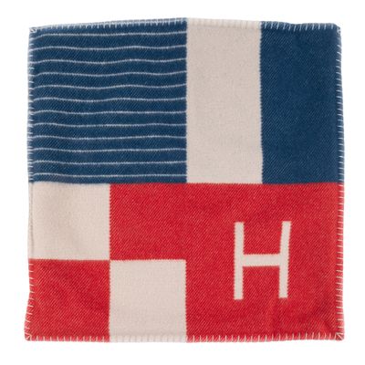 a red, white, and blue blanket with the letter h on it