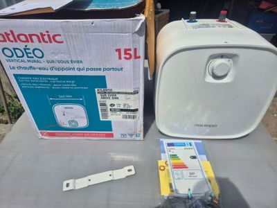 a box of electronic items on a table next to a box of electronic equipment