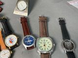 many different types of watches on the table
