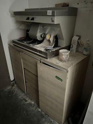 a kitchen with a stove, sink, and refrigerator in it