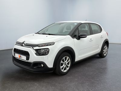 the white citrole is parked in a large room