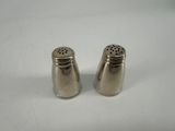 pair of silver salt and pepper shakers on a white surface