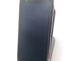 a cell phone that is sitting on top of a stand