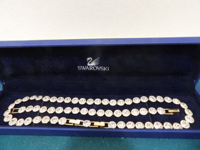 a close up of a blue box with a bracelet in it