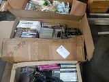a box full of dvds sitting on the floor