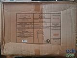 a cardboard box sitting on a pallet in a warehouse