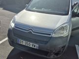 grey citroen van parked in a parking lot next to a building