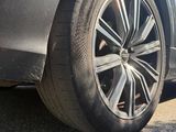a close up of a car tire on the road