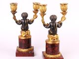 pair of antique bronze figurines of cherenshes on marble bases