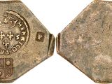 a close up of a coin with a coat of arms on it