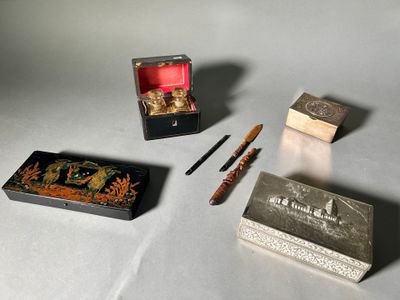 a small box with a pen, a box with a pen and a box with a pen on it