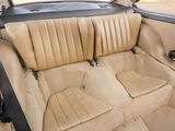 the interior of a car with tan leather seats and black trims