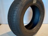 a close up of a tire on a white surface with a white background