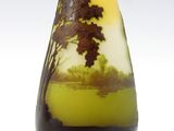 a glass vase with a picture of a tree on it