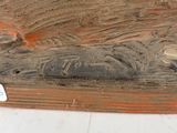 a close up of a piece of wood on a table