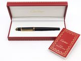 une image représentant un stylo dans une boîte rouge avec un bloc-notes