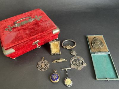 a small red box with many different items on it