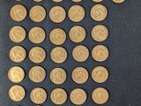 a lot of gold coins that are on a table