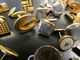 many different types of cuff watches on a table