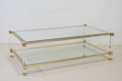 a glass and brass coffee table with a glass top
