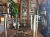 a glass table with a potted plant on top of it