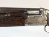 a close up of a gun on a white surface with a white background